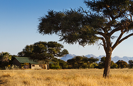 The Ondekaremba Lodge, surrounded by the African bush savannah.